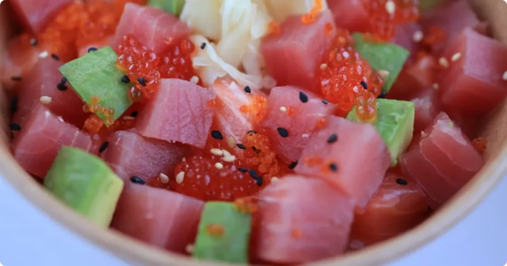 Fresh poke bowl with ahi tuna and rice, a staple of Hawaii's local food culture