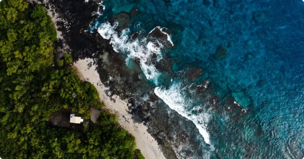 The Ultimate Hawaii Travel Guide: Best Islands, Itineraries and Insider Tips for Every Type of Traveler Aerial overview of the main Hawaiian islands surrounded by deep blue Pacific Ocean waters