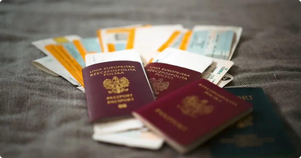 Passport and travel documents laid out on a desk core steps of a travel planning guide