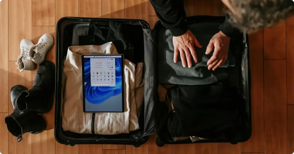 Lightweight summer clothing and packing cubes laid out for a Mexico vacation packing list